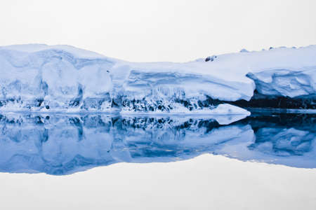 Antarctic iceberg in the snowの写真素材