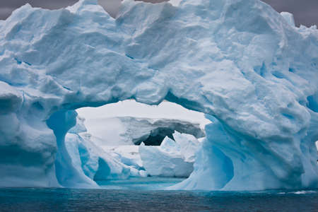 Large Arctic iceberg with a cavity insideの写真素材