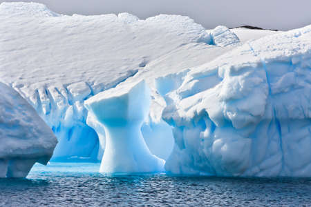 Huge iceberg in Antarctica, blue sky, azure water, sunny dayの写真素材