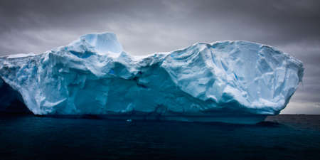 Antarctic iceberg in the snowの写真素材