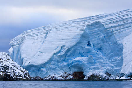 Huge Antarctic iceberg in the snowの写真素材