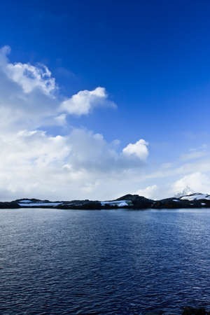 Beautiful snow-capped mountains against the blue sky in Antarcticaの写真素材