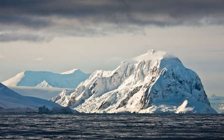 Beautiful snow-capped mountains against the skyの写真素材
