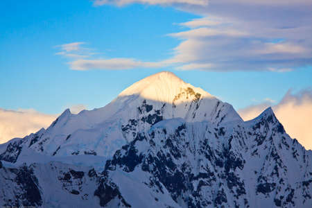 Beautiful snow-capped mountains against the blue sky in Antarcticaの写真素材