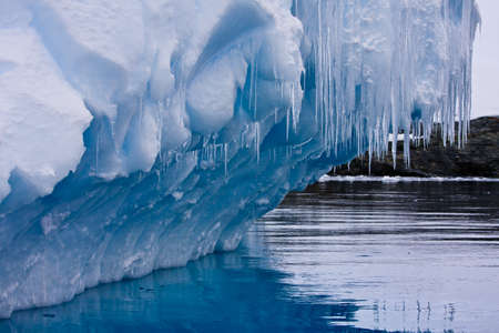 Reflection of the Antarctic Glacier with iciclesの写真素材