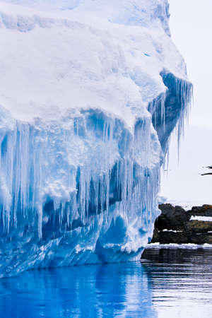 Reflection of the Antarctic Glacier with iciclesの写真素材