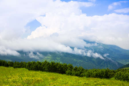 Mountains landscape with clouds and blue skyの写真素材