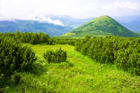 Mountains landscape with clouds and blue skyの写真素材