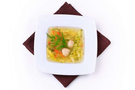 vegetable soup in white bowl with a spoonの写真素材
