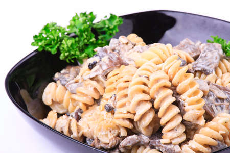 Cooked  pasta with meat and mushroomsの写真素材