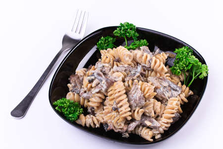 Cooked  pasta with meat and mushroomsの写真素材