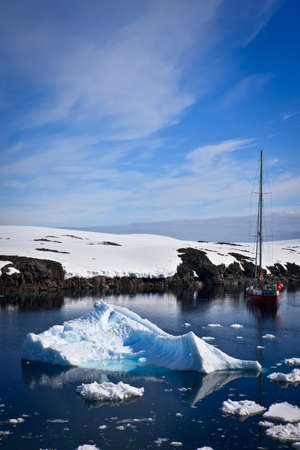 yacht sailing among the glaciers in Antarcticaの写真素材