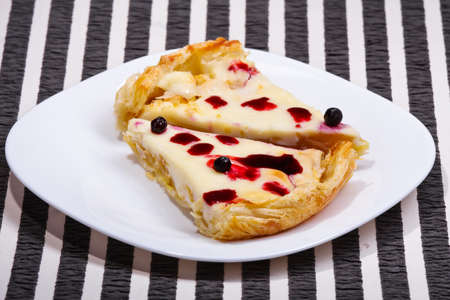 apple-cream pie with blueberries on a striped backgroundの写真素材