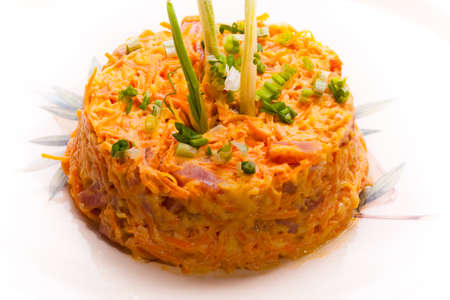 delicious salad with  carrots and ham on whiteの写真素材