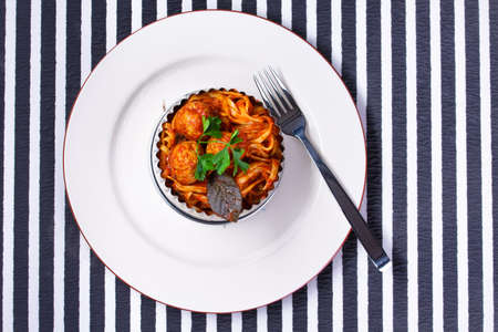 Spaghetti with meatballs on a white plateの写真素材