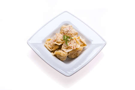 Dumplings in a white plate isolated on whiteの写真素材