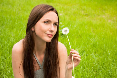 Girl with dandelionの写真素材
