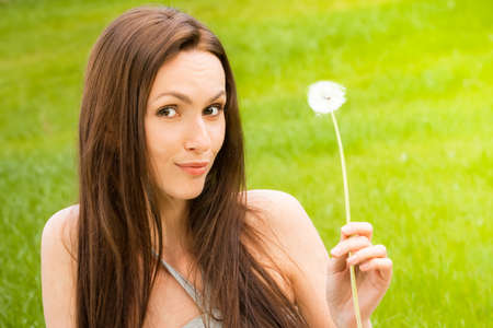 Girl with dandelionの写真素材
