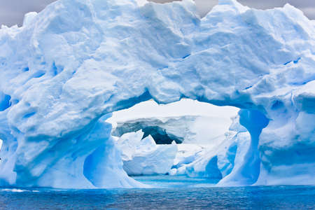 Large Arctic iceberg with a cavity insideの写真素材
