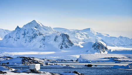 Beautiful snow-capped mountains against the blue skyの写真素材