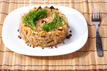 Braised cabbage with fennel on a wooden standの写真素材