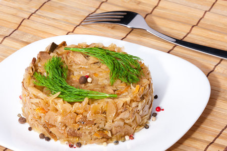 Braised cabbage with fennel on a wooden standの写真素材