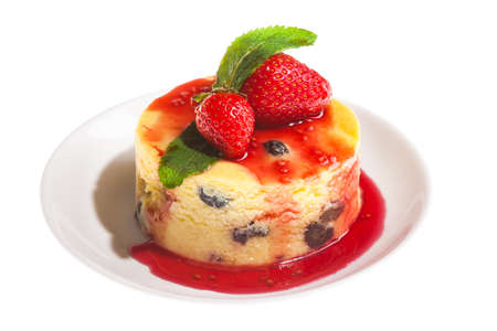 Cheesecake with fresh strawberries on white plate closeupの写真素材