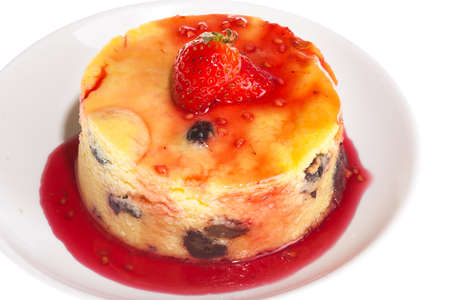 Cheesecake with fresh strawberries on white plate closeupの写真素材