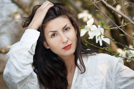 beautiful long hair brunette woman in natureの写真素材