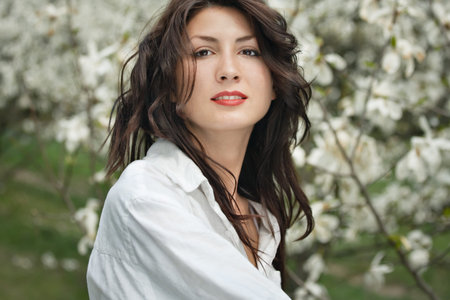 beautiful long hair brunette woman in natureの写真素材