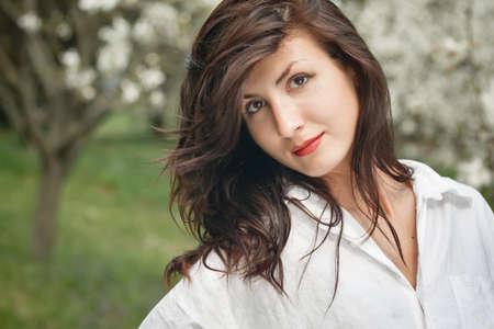 beautiful long hair brunette woman in natureの写真素材
