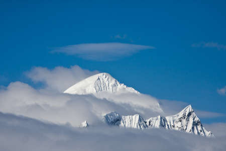 Beautiful snow-capped mountains against the blue sky in Antarcticaの写真素材