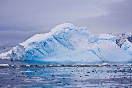 Antarctic iceberg in the snowの写真素材