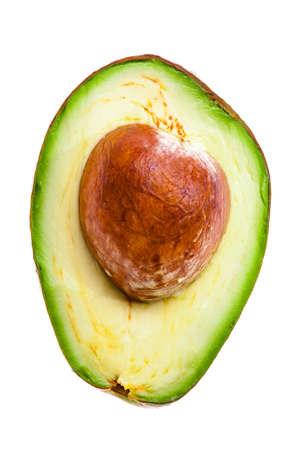 half of an avocado on a whiteの写真素材