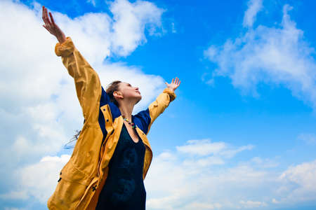 Beautiful young woman under blue sky. Portraitの写真素材