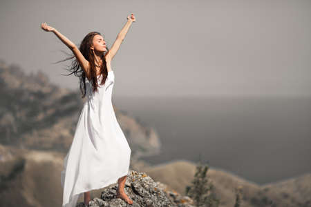 beauty woman on the rock in white tissueの写真素材