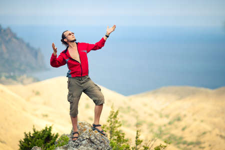 Man on top of mountainの写真素材