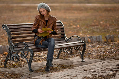 beauty girl in autumn parkの写真素材