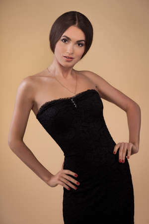 portrait of beautiful girl on golden backgroundの写真素材
