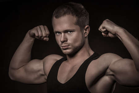 Handsome athlete on a black backgroundの写真素材