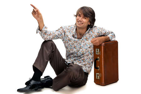portrait of man with a suitcase on a white backgroundの写真素材