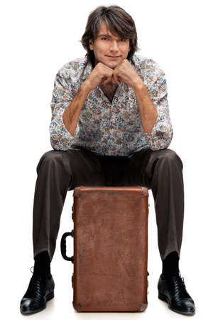 portrait of man with a suitcase on a white backgroundの写真素材