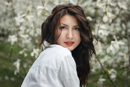 beautiful long hair brunette woman in natureの写真素材