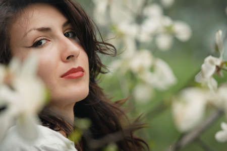 beautiful long hair brunette woman in natureの写真素材