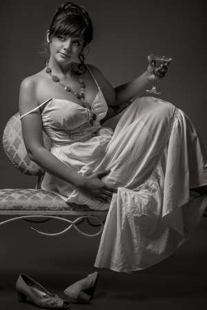 girl sitting on the retro sofaの写真素材