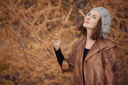 young girl in autumn parkの写真素材