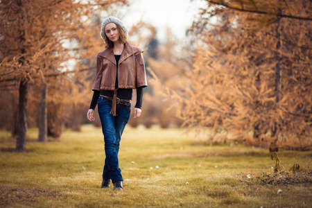 young girl in autumn parkの写真素材