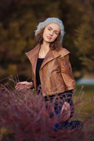 young girl in autumn parkの写真素材