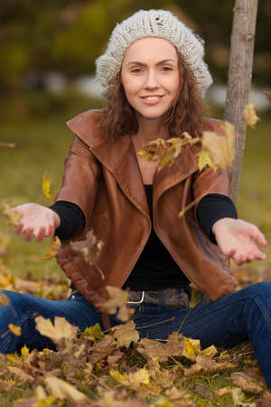 young girl in autumn parkの写真素材