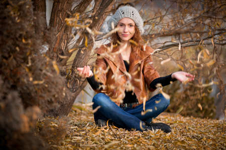 young girl in autumn parkの写真素材